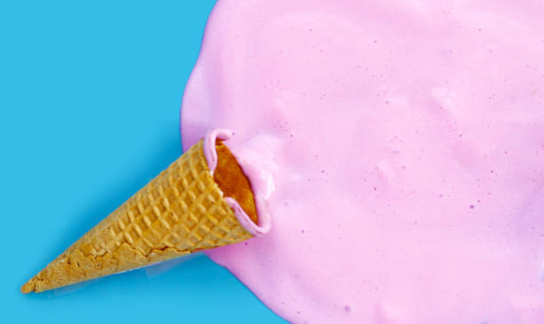 istock Melting ice cream with waffle cone on blue background. 2154779055