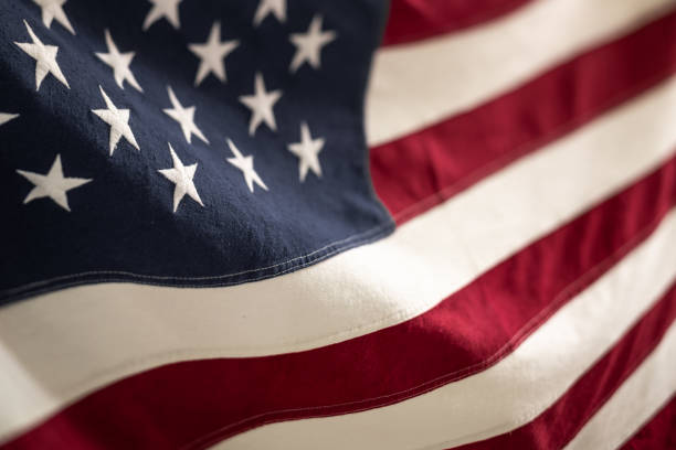 istock Vibrant American Flag Waving Outdoors on a Sunny Day 2154780933