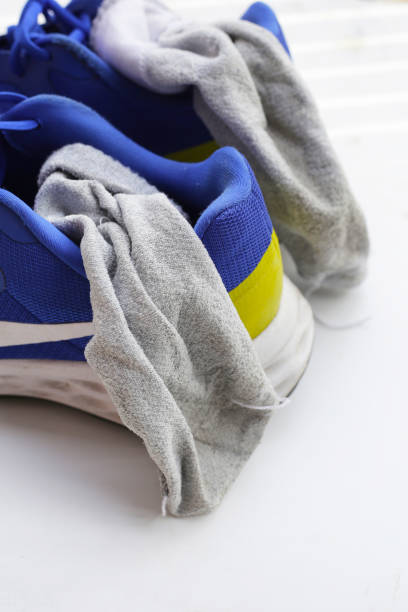 istock Blue sneakers with dirty socks 2154782346