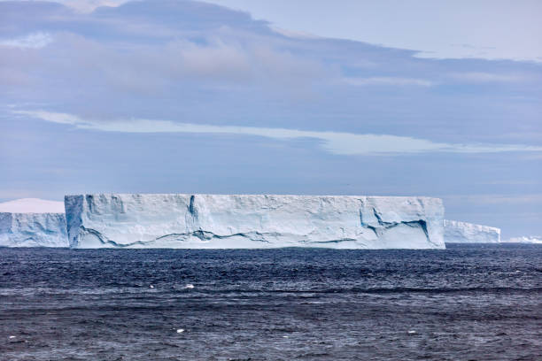Iceberg floating on the ocean seen from the coast of the Disko Island outside Ilulissiat in western Greenland