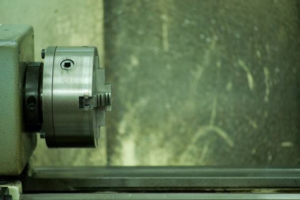 Old metal lathe machine, retro machine background.