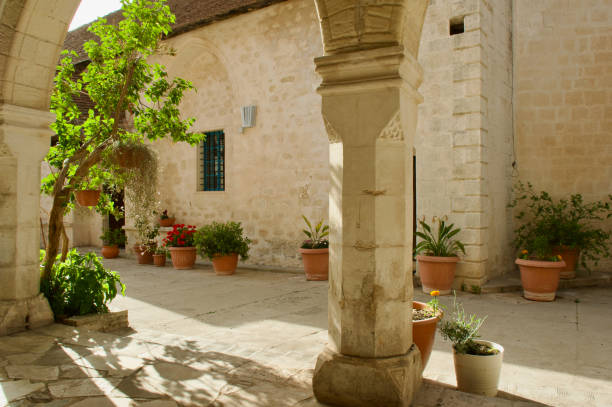 istock Arches with flower pots and pretty flowers 2154785222