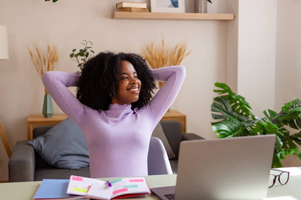 istock Young woman relaxed while working from home 2154788623
