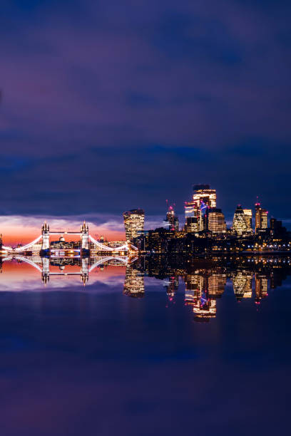 Tower bridge and London skyline at night, UK