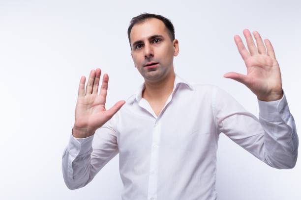 istock Smart handsome caucasian man in a white shirt on a white background 2154795211
