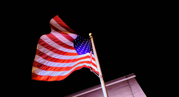 istock USA Flag Flying Against Night Sky 2154796840