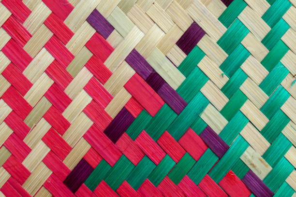 Colorful Ulos fabrics showcasing indigenous ethnic design and intricate patterns of the Batak people of North Sumatra Indonesia, on display for sale in the local market