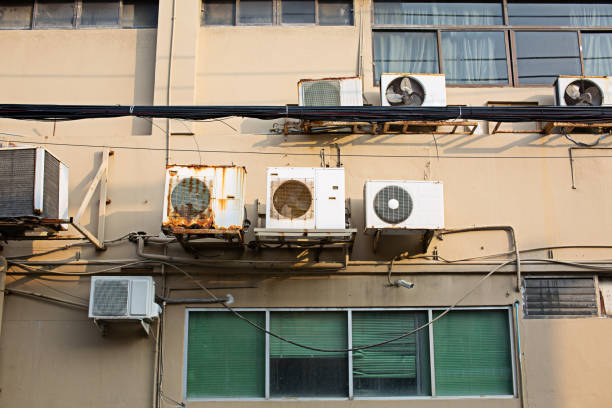 istock Many rusty air conditioners installed outside the building 2154805622