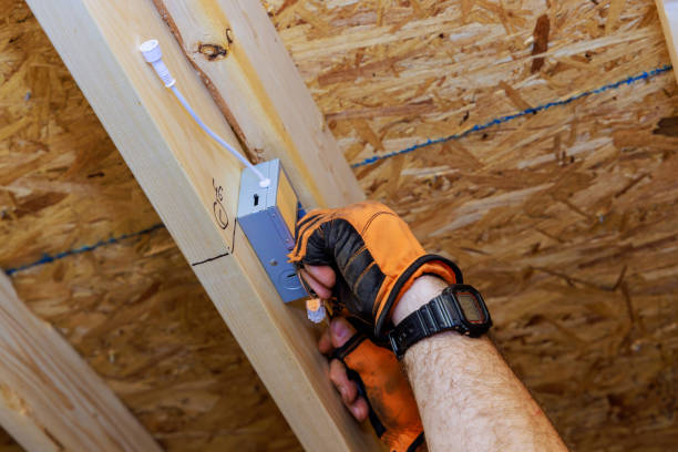 istock Installing power junction box for LED recessed ceiling lights in a new residence by an electrician 2154806725