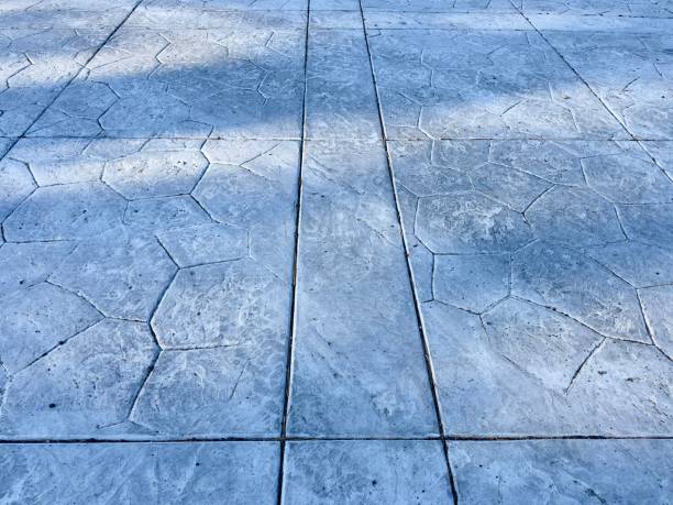 istock Overhead view of a neatly arranged stone concrete driveway, showcasing a robust and functional design with clean lines. 2154808096