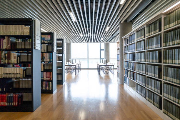 istock Rows of books on shelves in modern library 2154809075