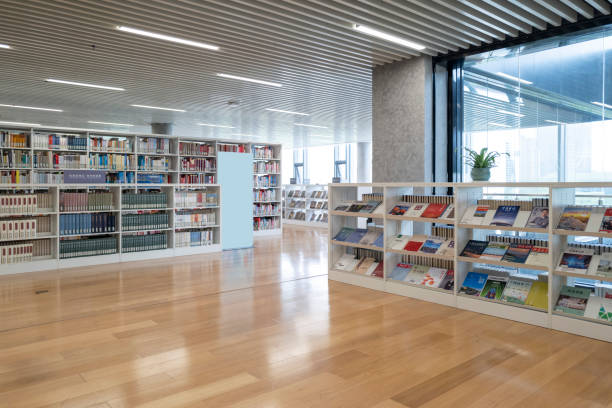 istock Rows of books on shelves in modern library 2154809076