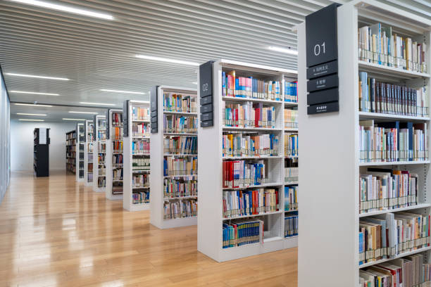 istock Rows of books on shelves in modern library 2154809081