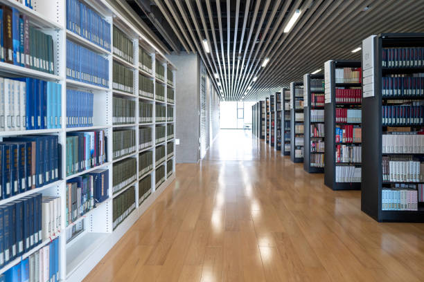 istock Rows of books on shelves in modern library 2154809084