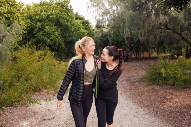 istock Two Friends Going For A Late Afternoon Walk 2154811168