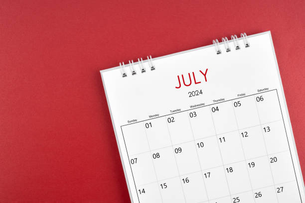 istock July 2024 desk calendar on red background. 2154811576