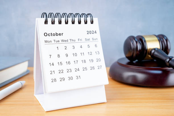 istock Desk calendar for October 2024 and judge's gavel. 2154811587