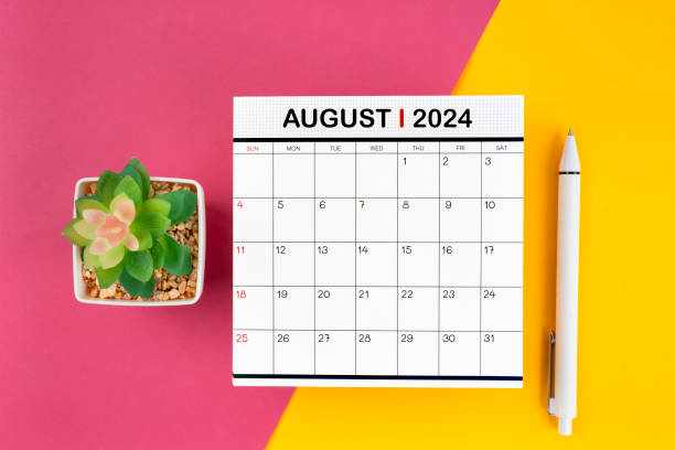 istock White calendar for August 2024 and pen on beautiful background. 2154811603