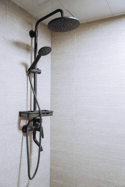 istock Modern shower zone with rain head, hand held shower. 2154811659