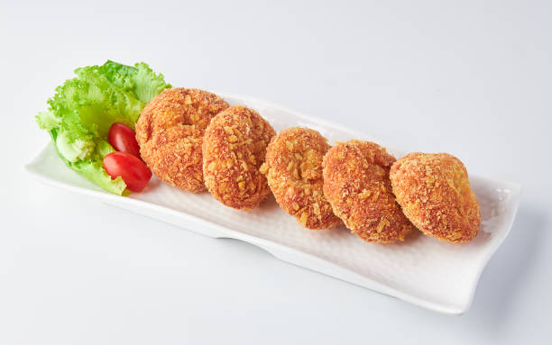 istock Shrimp Donut (Shrimp coated in flour and bread crumbs fried in oil) served on white plate isolated on white background. 2154814475