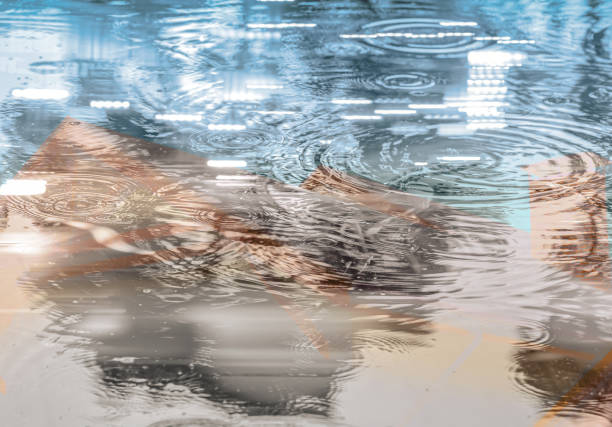 double exposure urban abstract background. raindrops on water surface with city reflections.