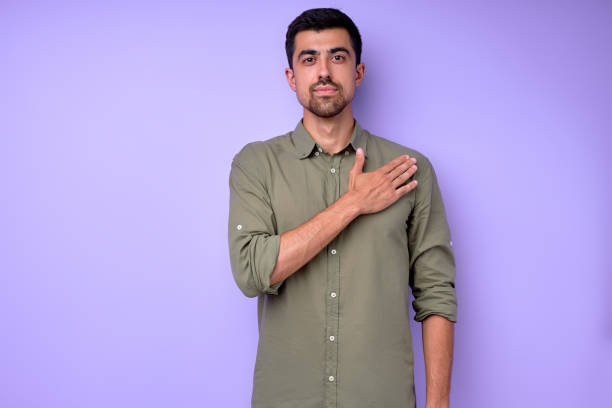 istock handsome deaf man with palm on his breast, saying please 2154817408