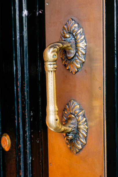 istock Old metal handle on wooden door 2154822267