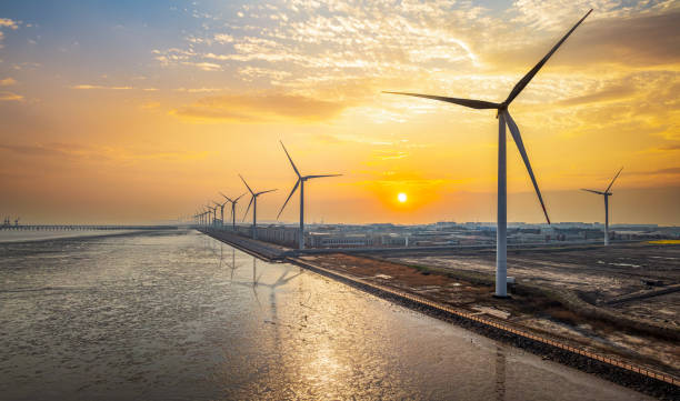 istock Wind power station by the sea at sunset 2154824210