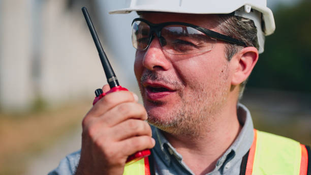 istock Portrait of Railway worker on walkie talkie checking rails. 2154824333