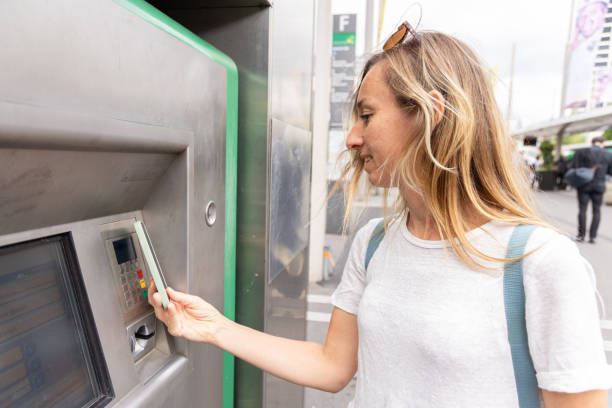 istock Woman Paying with Card at Ticket Machine 2154824387