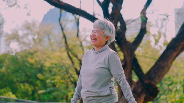 istock Happy senior woman relaxing and having fun in  park. 2154824657
