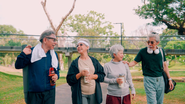 istock Happy senior people  after exercise workout having fun outdoors at park city. 2154824737