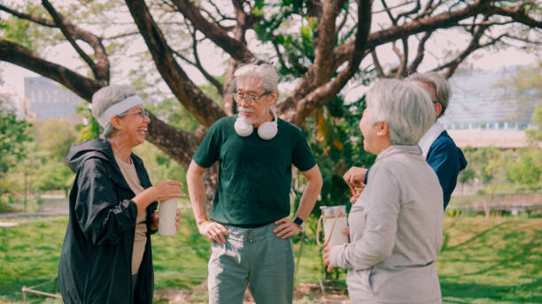 istock Happy senior people  after exercise workout having fun outdoors at park city. 2154824742