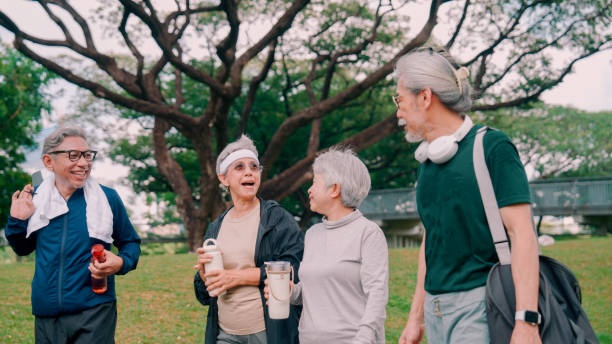 istock Happy senior people  after exercise workout having fun outdoors at park city. 2154824752