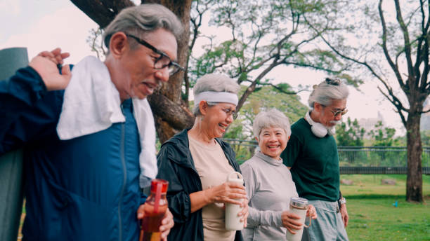istock Happy senior people  after exercise workout having fun outdoors at park city. 2154824753