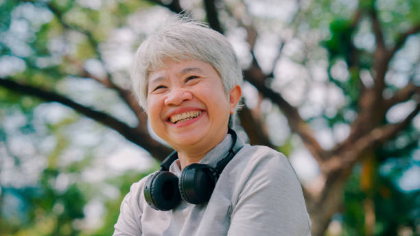 istock Motivated senior woman browsing some music for her outdoor workout routine. 2154824875