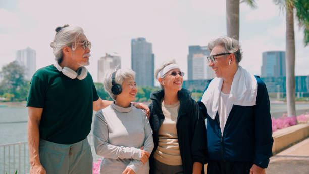 istock Happy senior people  having fun running outdoors in park city. 2154824929