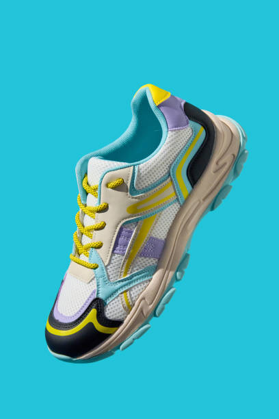 istock Fashionable Sneaker on blue background. Creative banner with stylish shoes 2154824962