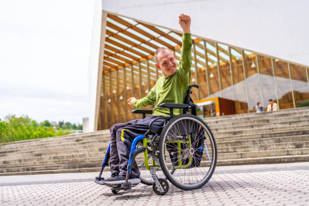 istock Disabled man celebrating he achieve to go to the university 2154825055