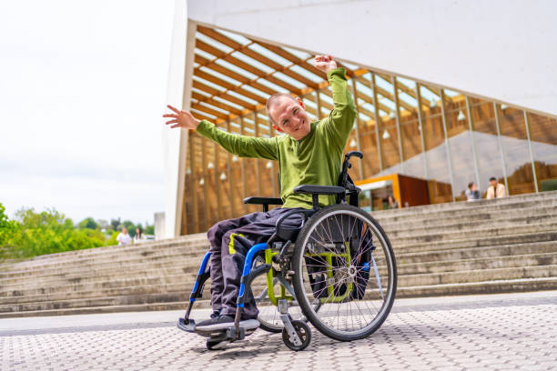 istock Disabled man with cerebral palsy proud being in the university 2154825075