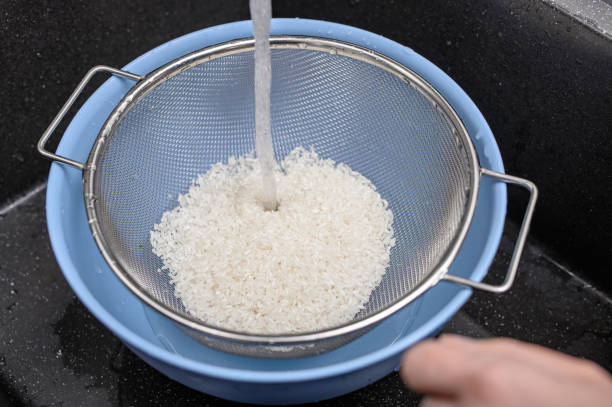 istock Rice soaked in water, rinsed to remove excess starch 2154825552