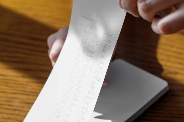 istock Turn over the sheet of paper written down with expenses in your notebook 2154825594
