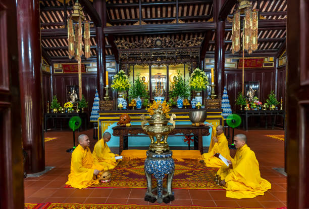 Hue, Vietnam - April 10th, 2024: View of inside Thien Mu temple, with monks holding a peace ceremony at the hundred-year-old ancient temple in Hue, Vietnam