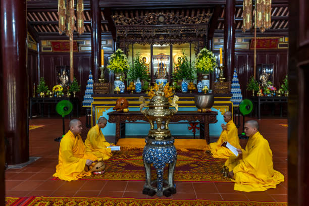 Hue, Vietnam - April 10th, 2024: View of inside Thien Mu temple, with monks holding a peace ceremony at the hundred-year-old ancient temple in Hue, Vietnam