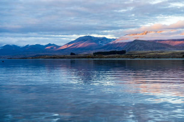 istock Lake Tekapo and the cloudy mountains in the evening 2154828650
