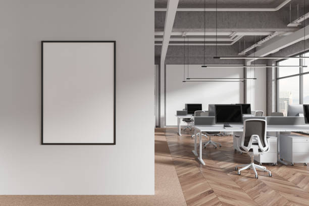 istock White industrial open space office interior with poster 2154829631