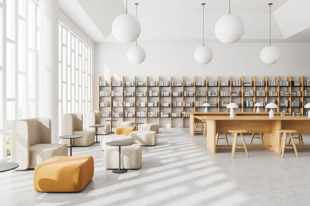 istock Cozy library interior with bookshelf, lounge and work zone with desks and window 2154829634