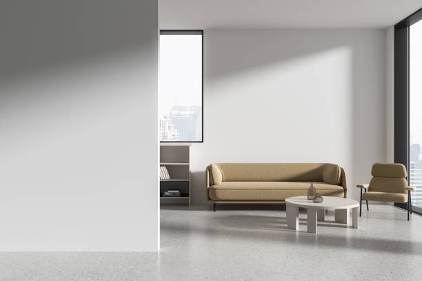 istock White office interior with relax place with shelf and window. Mock up wall 2154829732