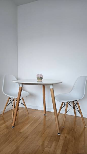 istock round table in interior with parquet floor and white wall 2154830692