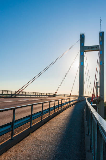 istock Sun Shines Over Bridge on Road 2154831981